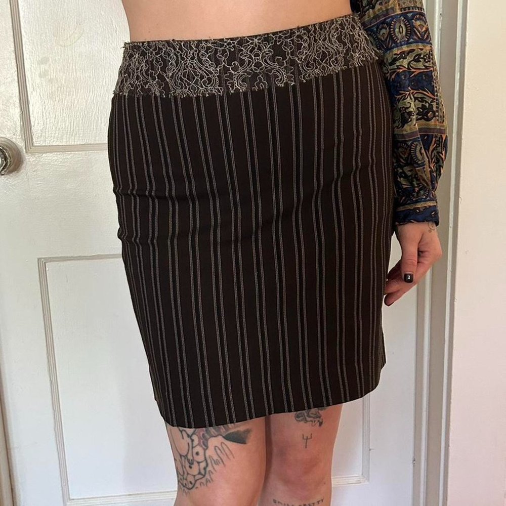pinstripe miniskirt with lace detailing around the waist.